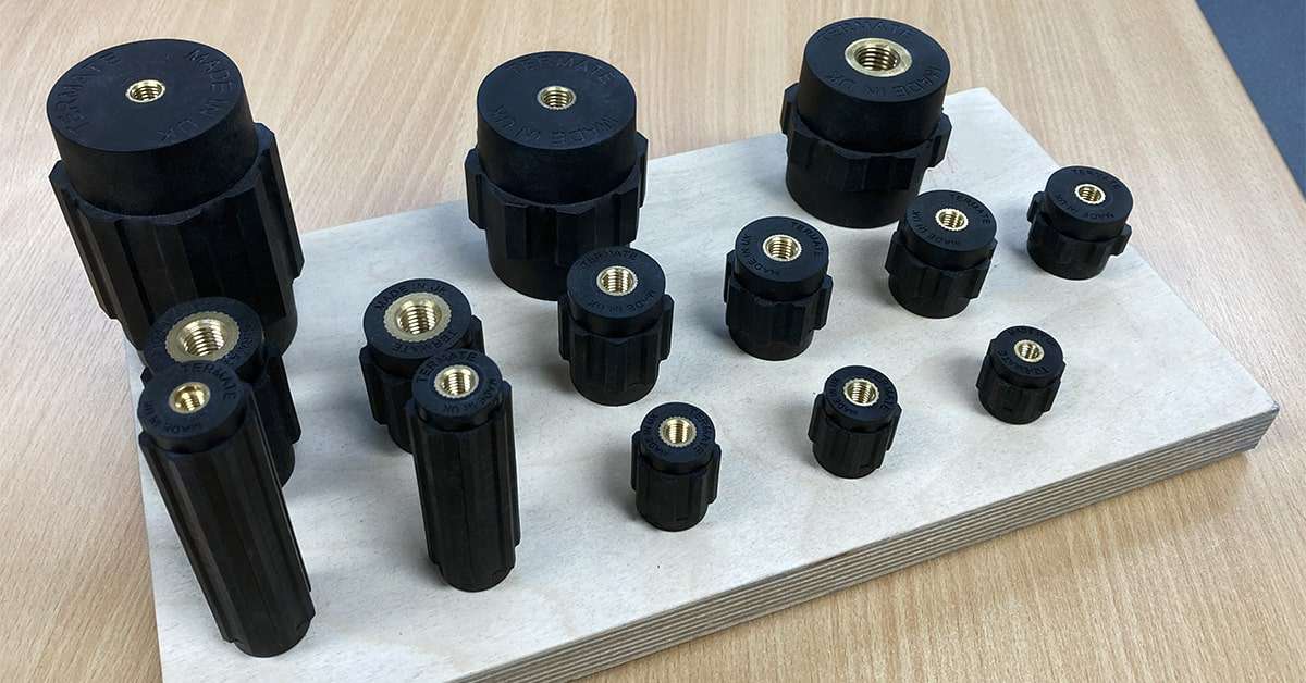 Arrangement of low voltage standoff insulators with different heights, widths and inserts sizes, suitable for switchgear and controlgear assemblies