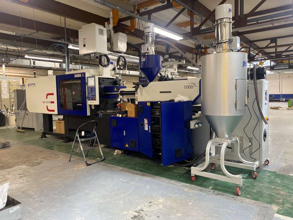 Photograph of Haitian Injection Moulding Machine being situated in Termate's new injection moulding facilities in Nottingham, UK
